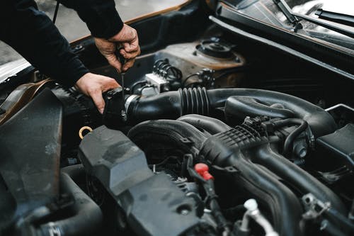 mechanic working under the hood of a car in lexington nc